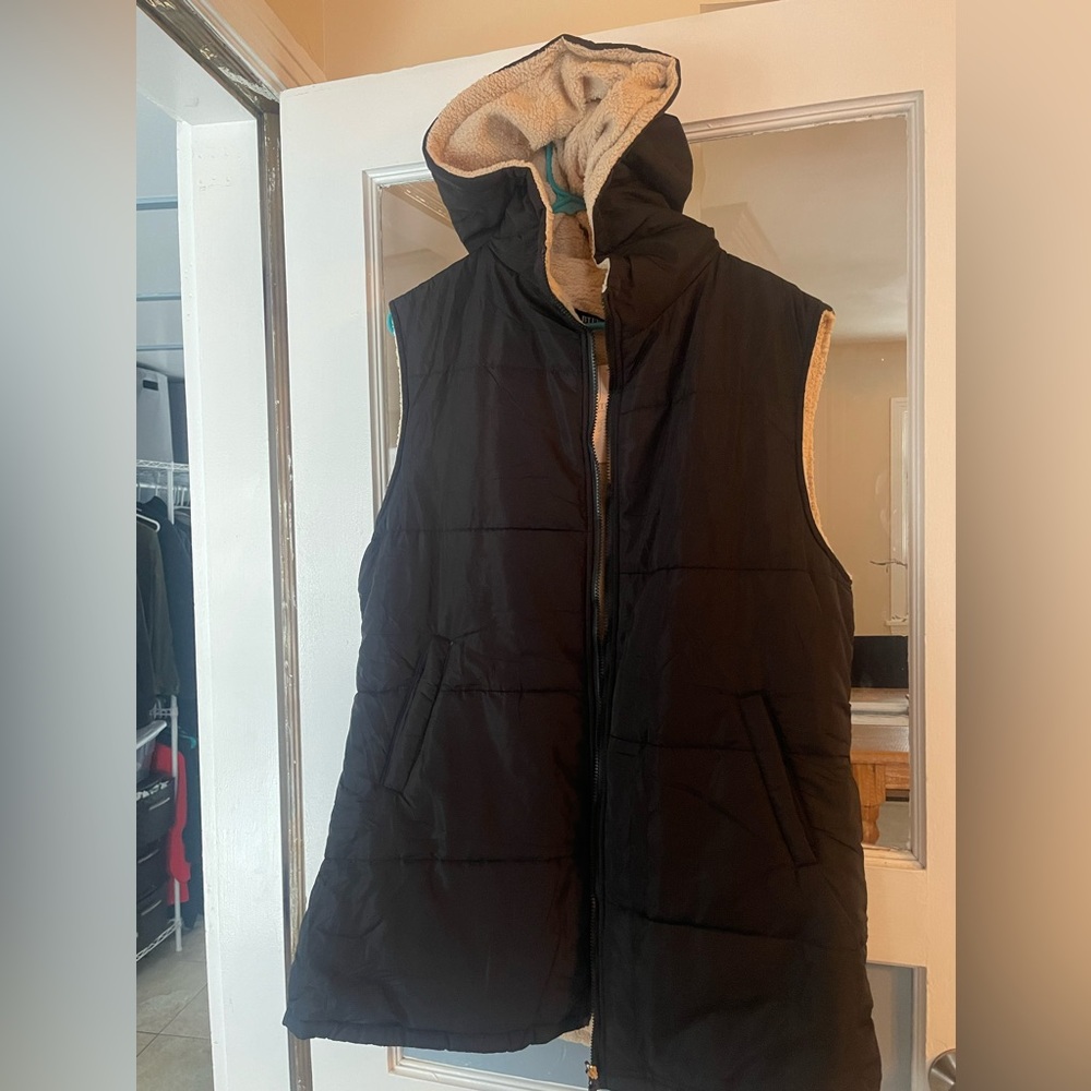 Long vest with hood. Reversible.